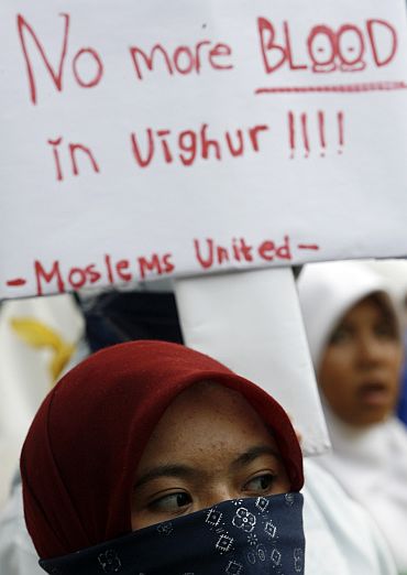Muslim students rally outside China's embassy in Jakarta to protest against the deaths of Uighurs in riots in China's Xinjiang province