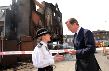 Prime Minister David Cameron talks to Acting Borough Commander Superintendent Jo Oakley during a visit to Croydon