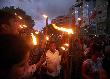 Supporters of activist Anna Hazare participate in an anti-corruption rally