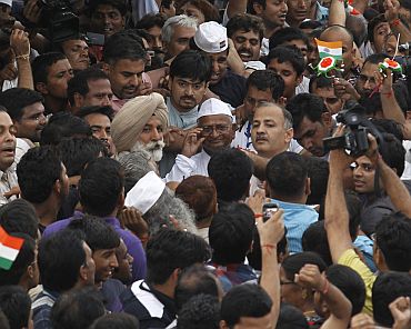 Anna Hazare leaves after praying at Rajghat in New Delhi on Monday