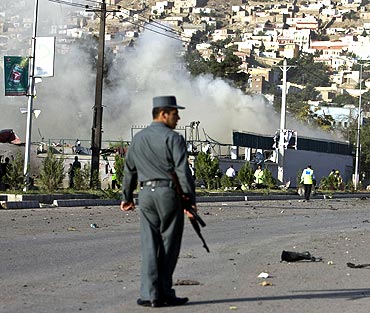 Smoke billows during an attack on offices belonging to the British Council in Kabul