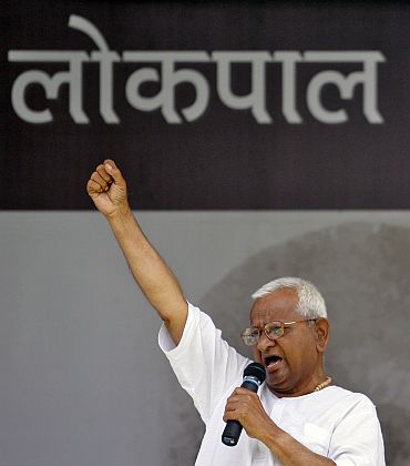 Anna Hazare shouts slogans as he addresses his supporters