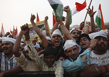 Supporters of veteran Indian social activist Anna Hazare shout slogans at the Ramlila ground