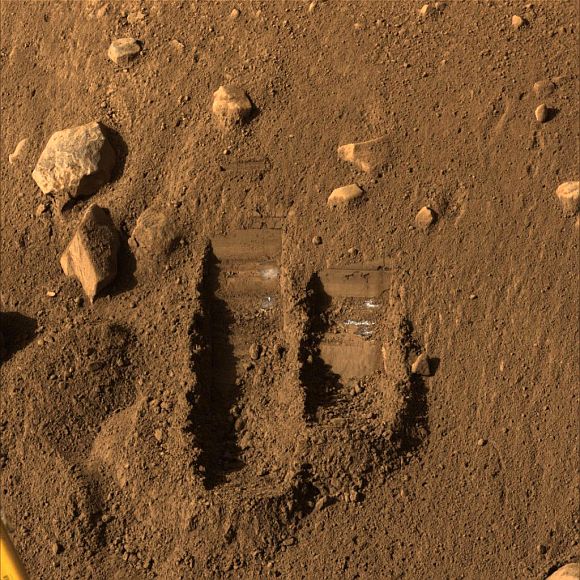 NASA's Phoenix Mars Lander's Surface Stereo Imager shows two trenches dug by Phoenix's Robotic Arm