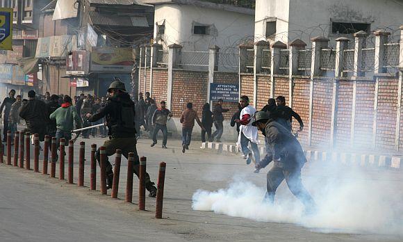 Kashmiri youth clashed with security forces during a Muharram procession in Srinagar on Sunday