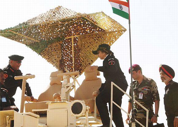 President Patil climbing on board the T-90 Tank of the Indian Army during Exercise Sudarshan Shakti near Jodhpur on December 5