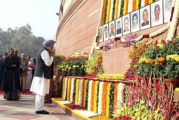 Prime Minister Manmohan Singh pays homage to the victims of the December 2001 parliament attack on its 10th anniversary in New Delhi