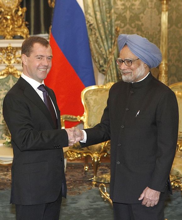 Russian President Dmitry Medvedev shakes hands with Prime Minister Manmohan Singh during their meeting in Moscow's Kremlin