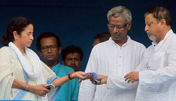 Mamata Banerjee and Mukul Roy (extreme right).