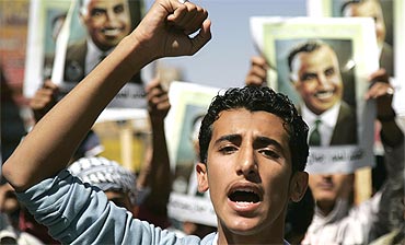 A protester shouts slogans during a demonstration in Sanaa, Yemen on Friday in support of Egypt protests
