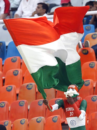 An Indian cricket fan waves the tricolour during a Test match between Australia and India in Mohali.
