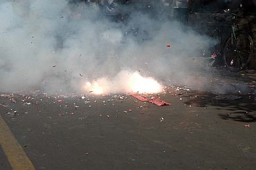 People burst firecrackers to celebrate HC's decision to uphold Kasab's death sentence in Mumbai on Monday