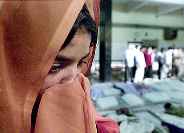 A file photo of a woman searching for her family members at a morgue in Ahmedabad, a day after the Godhra carnage