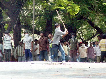 Pro-Telangana protestors clash with security personnel during the shutdown on Tuesday