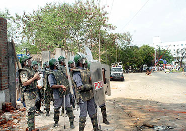 Police personnel used tear gas shells to disperse the agitating protestors