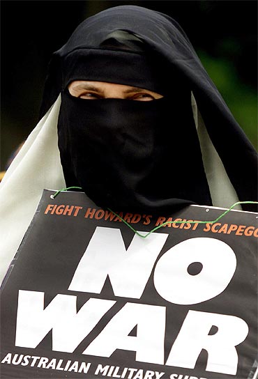 A Muslim woman from Sydney participates in a peace rally condemning racism