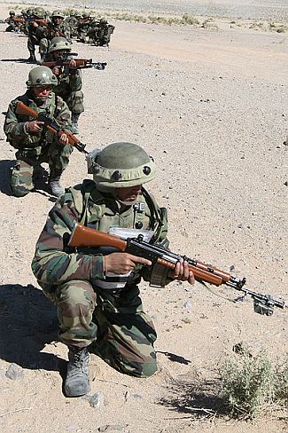 An army unit takes position during an exercise