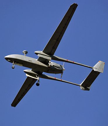 An Israeli-made Heron unmanned aerial vehicle flies over Porbandar, during its commissioning into the Indian Navy, January 17