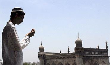 A man prays at the Mecca Masjid in Hyderabad