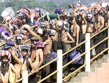 Pilgrims queue outside the Sabarimala Temple to offer prayers to Lord Ayyappa