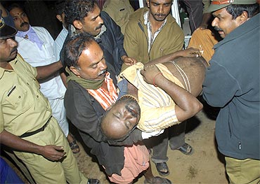 A devotee who was injured after the stampede is taken to a hospital at Kumily in Kerala