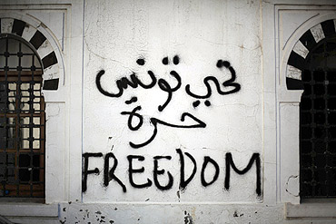 Revolutionary graffiti adorns a wall of the prime minister's office in Tunis