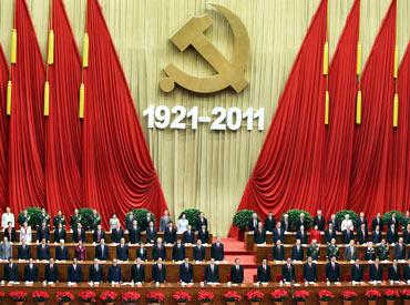 Members of the Communist Party stand and sing the song Internationale during the celebration of CPC's 90th anniversary at the Great Hall of the People on Friday in Beijing.