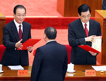 Chinese President Hu Jintao (right) and Chinese Premier Wen Jiabao (left) award the certificate to the outstanding Communists during the celebration at the Great Hall of the People