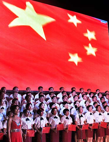 A choir sings 'red songs' on stage to mark the 90th anniversary Of The Communist Party Of China in Binzhou
