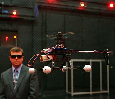 Dr Gregory Parker, Micro Air Vehicle team leader, observes a computer controlled drone