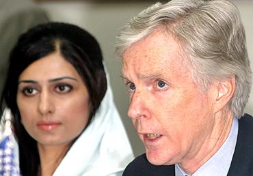 File photo of US Ambassador to Pakistan Ryan Crocker speaking with Khar