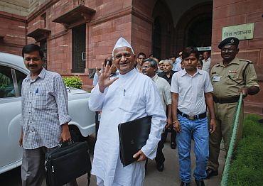 Anna Hazare and Arvind Kejriwal, members of the joint Lokpal drafting committee, step out after a meeting in New Delhi