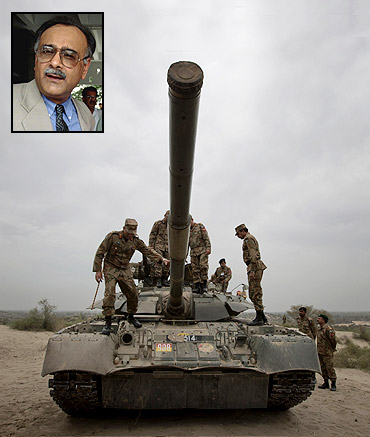 Top Pakistan Army officials climb atop a tank during military exercises in central Punjab's Muzaffargarh district and (inset) Najam Sethi