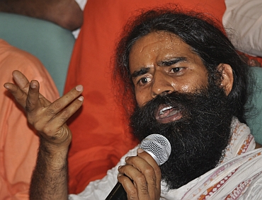 Baba Ramdev can be seen with the dupatta around his neck