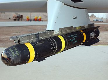 A Hellfire is attached to a Predator drone