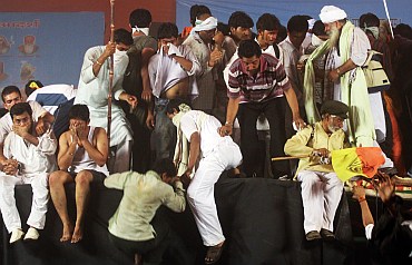 Ramdev's supporters scatter after police evicted them from Ramlila Maidan