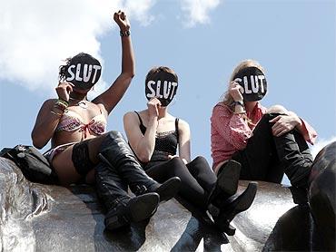 SlutWalk participants cheer a speaker, after walking from Hyde Park Corner, in Trafalgar Square, central London