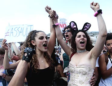 SlutWalk participants cheer a speaker, after walking from Hyde Park Corner, in Trafalgar Square