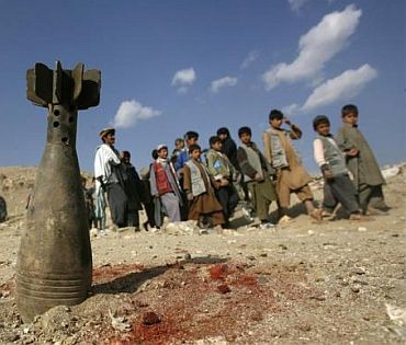 A defused mortar head is planted during a mine and unexploded ordnances awareness class for school boys in Qarabagh district, north of Kabul