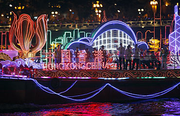 Hong Kong athletes stand on a boat floating on the Pearl river during the opening ceremony of the 16th Asian Games in Guangzhou, Guangdong.