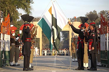 Pakistan Rangers and Border Security Force take part in the daily flag lowering ceremony at the joint border post of Wagah