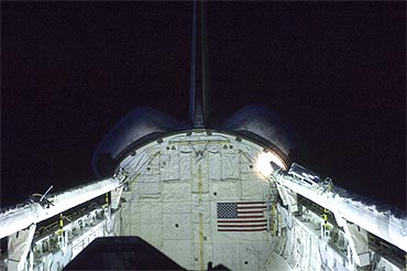 Discovery's vertical stabiliser, orbital maneuvering system pods, remote manipulator system and payload bay are featured in this photo provided by NASA