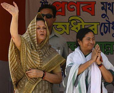 Congress chief Sonia Gandhi with Trinamool chief Mamata Banerjee at a poll rally in West Bengal