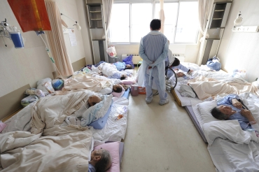 Patients wait to be rescued from a hospital where there is no electricity or medicine in Otsuchi town in Iwate Prefecture