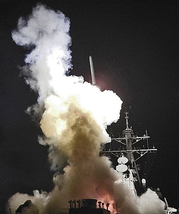 Arleigh Burke-class guided-missile destroyer USS Barry (DDG 52) launches a Tomahawk missile in support of Operation Odyssey Dawn in the Mediterranean Sea