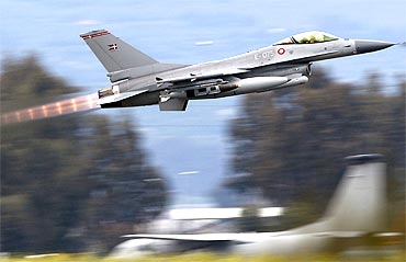 A Danish F-16 Fighting Falcon takes off from the tarmac of the Sigonella NATO Airbase on the southern Italian island of Sicily
