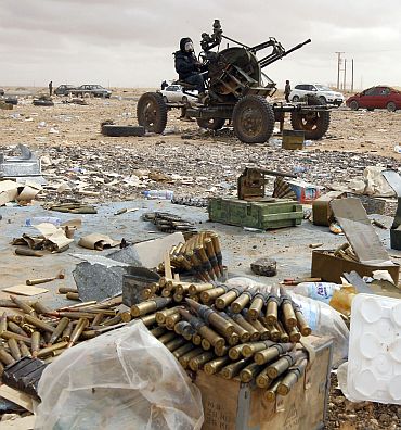 A rebel mans an anti-aircraft gun in Ras Lanuf