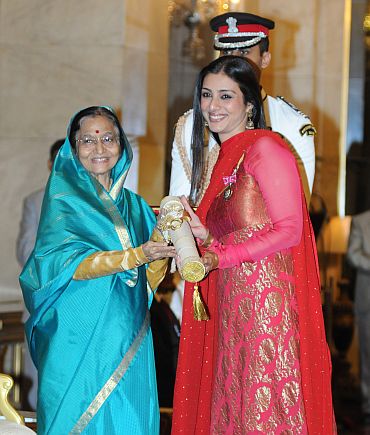 President Pratibha Devisingh Patil presenting the Padma Shri to actress Tabu