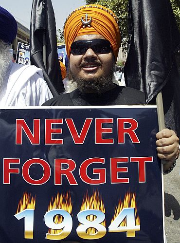 A protestor participates in a rally condenming the 1984 Sikh riots in Amritsar