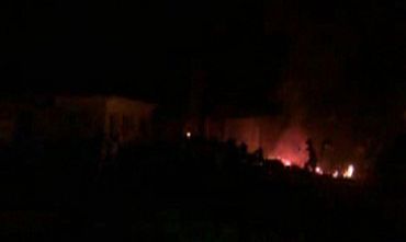 The compound, within which bin Laden was killed, is seen in flames after it was attacked in Abbottabad in this still image taken from video footage from a mobile phone
